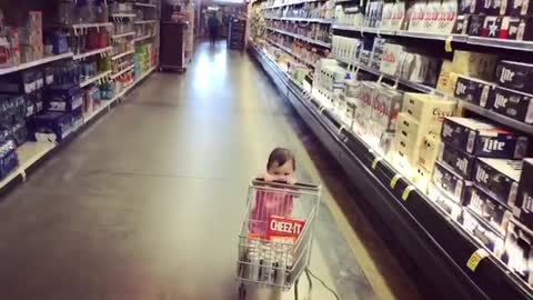 Collab copyright protection - baby in pink faceplant in beer aisle