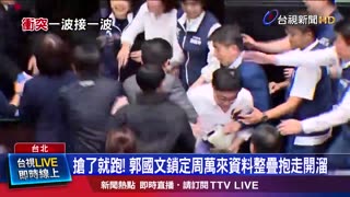 Member of the Taiwanese parliament grabs bill and ran to prevent it from being passed