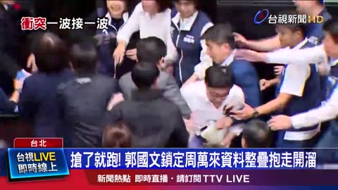 Member of the Taiwanese parliament grabs bill and ran to prevent it from being passed