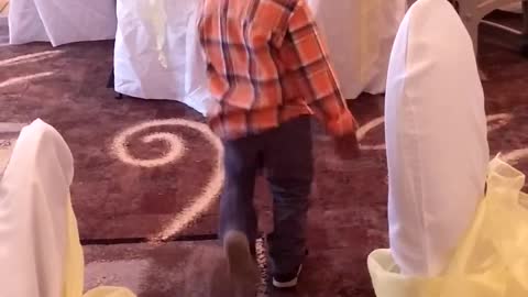 Little boy funky dance at wedding