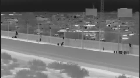 Migrants captured after dropping over border wall