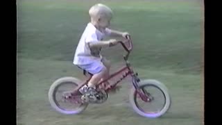 Kid Learning To Ride Bike Pedals Right Into A Truck