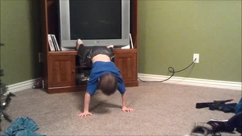 Kid can't quite grasp concept of push-ups