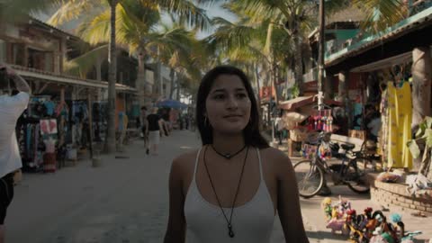 Girl walking on a beach street