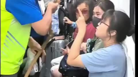 A man on a subway in northern China forcibly demanding a seat from a girl.