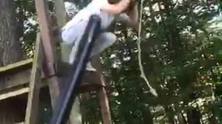 Long haired man rope swing