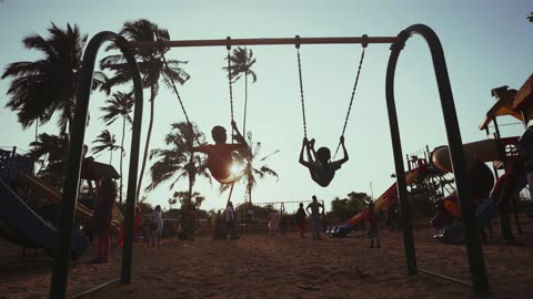 Kids Enjoying Swings