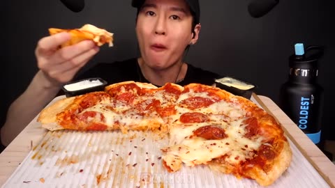 Eating pizza - big pizza with lots of cheese
