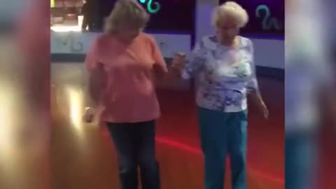 Elderly Sisters Show off Skating Skills at Roller Rink