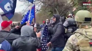 Jan. 6 Trump supporters are seen protecting the police from antifa.