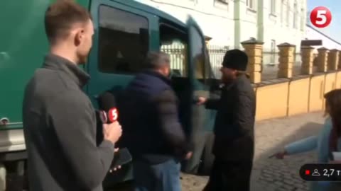 Ukraine, in the footage a Nationalist woman cheerfully harasses an Orthodox Priest.
