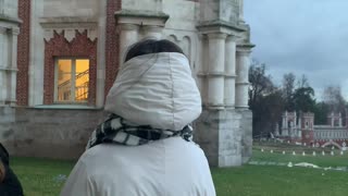 Pieces Crumble and Fall Near Woman at Tsaritsyno Museum-Reserve