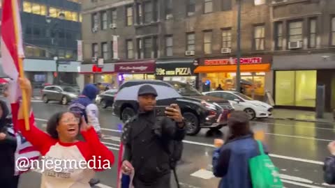 "Vehicles Honk" as they pass protestors outside the Canadian Consulate in New York