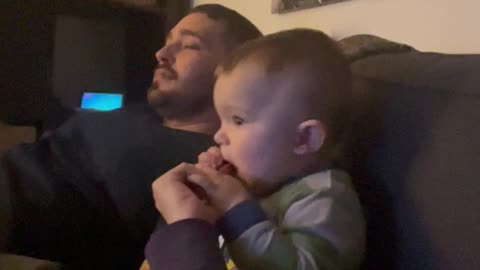 Baby Drops Pacifier and Takes Bread From Dad