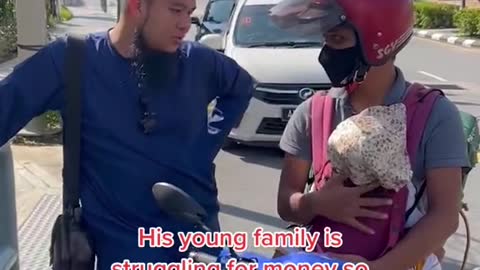 Malaysian GrabFood rider carries toddler along for deliveries