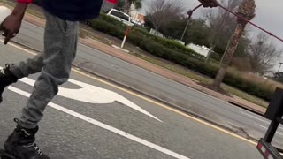 Rollerblader Hitches a Ride Behind Delivery Truck