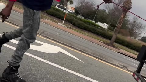 Rollerblader Hitches a Ride Behind Delivery Truck