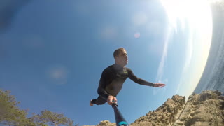 Daredevil loses GoPro during insane 70 foot cliff dive
