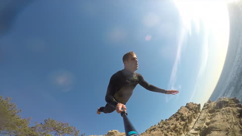 Daredevil loses GoPro during insane 70 foot cliff dive