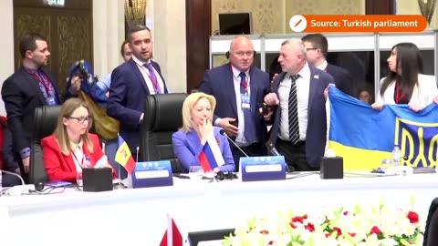 Ukrainian summit delegate punches Russian in face