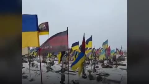 A Ukrainian man walks in one of the cemeteries of Kharkov