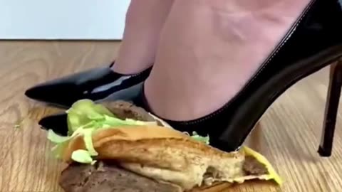 Girl Crushing Food item with own heel