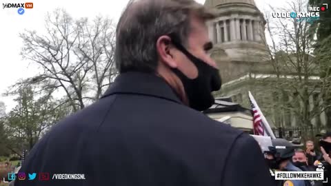 Fox News Reporter Assaults a protester because a Trump flag