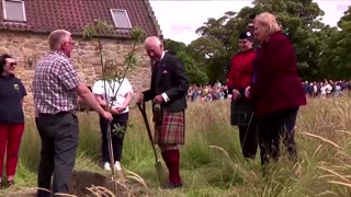 King Charles plants tree during Scotland visit