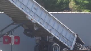 Unloading A Truckload Of Coal