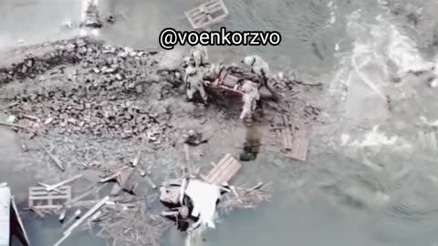 Ukrainian troops evacuating a injured soldier to safety