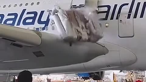 The moment the plane pops out of the air ladder