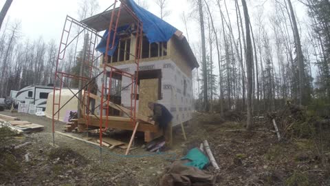 Electric and installing the post and beam on porch || A guy builds a homestead in Alaska by himself