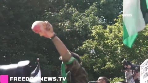 Pro-Palestinian protesters hold up bloody mask of Joe Biden