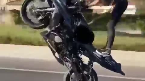 Bike stunt performed by girl