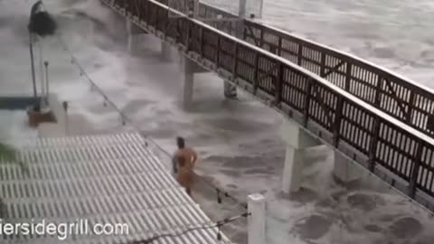 Florida Man at Fort Myers Beach Pier During Hurricane Ian