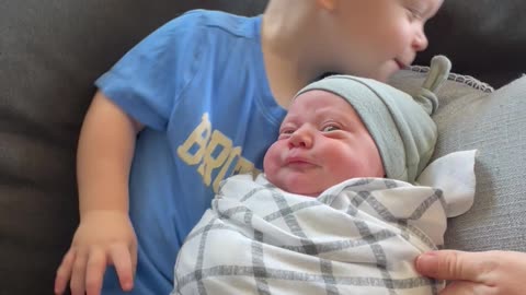 Boy Holds Little Brother for the First Time