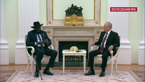 Putin teaches the president of South Sudan how to use headphone