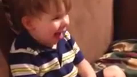 Toddler hilariously imitates panting dog