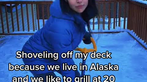 Shoveling off my deck because we live in Alaska and we like to grill at 20 below