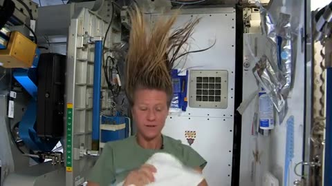 Keren Nyberg expedition 36 crew member flying hair in the space