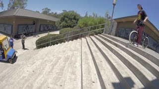 BMX Rider Ignores Security Guard and Lands Trick Over Stairs