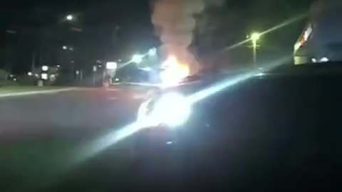 police jumped to the rescue after a passenger was stuck inside a burning car.