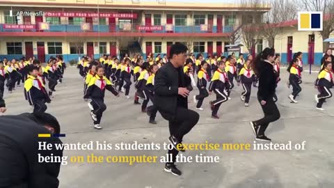 Chinese school principal teaches students shuffle dance during break