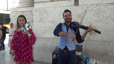 Blue and White Duo Busking in Lisbon Portugal 20th June 2018. String Quartet