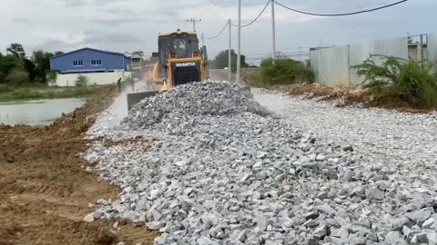 New bulldozer spreading gravel processing features building road foundation-1