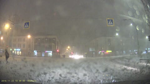 Pedestrian Rolls over Snowy Road