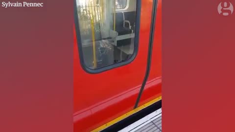 Burning device filmed on tube carriage at Parsons Green station