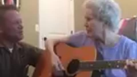 88 year old lady with alzheimers plays guitar and sings with her son