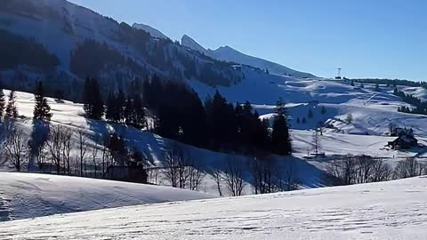 Beautiful scenery of Swiss country snow-capped mountains