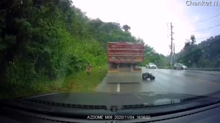 Motorcyclist Loses Control on Wet Roads